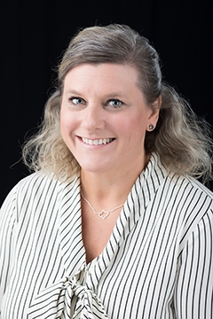 Jennifer Shaffer smiles enthusiastically. Jennifer Shaffer