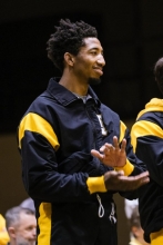 Redshirt senior Jon Jon Millner applauds as his team defeats Duke 42-3 on Jan. 24, 2023.